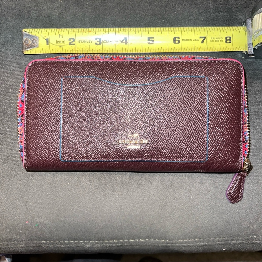 The Coach Women’s Pebbles Leather Zip Around Wallet in Burgundy